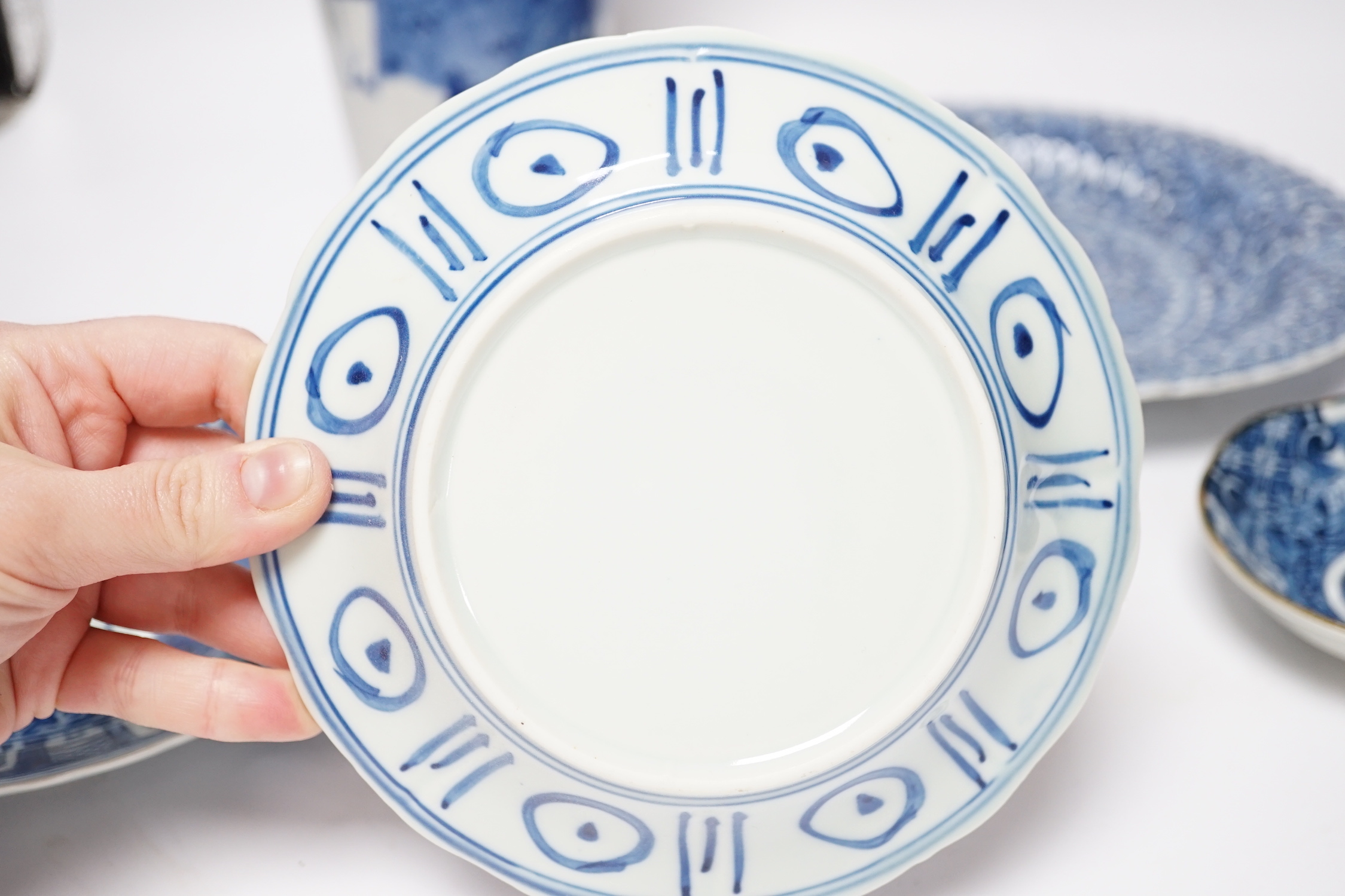 A group of Chinese blue and white dishes and plates and a damaged vase, 30cm